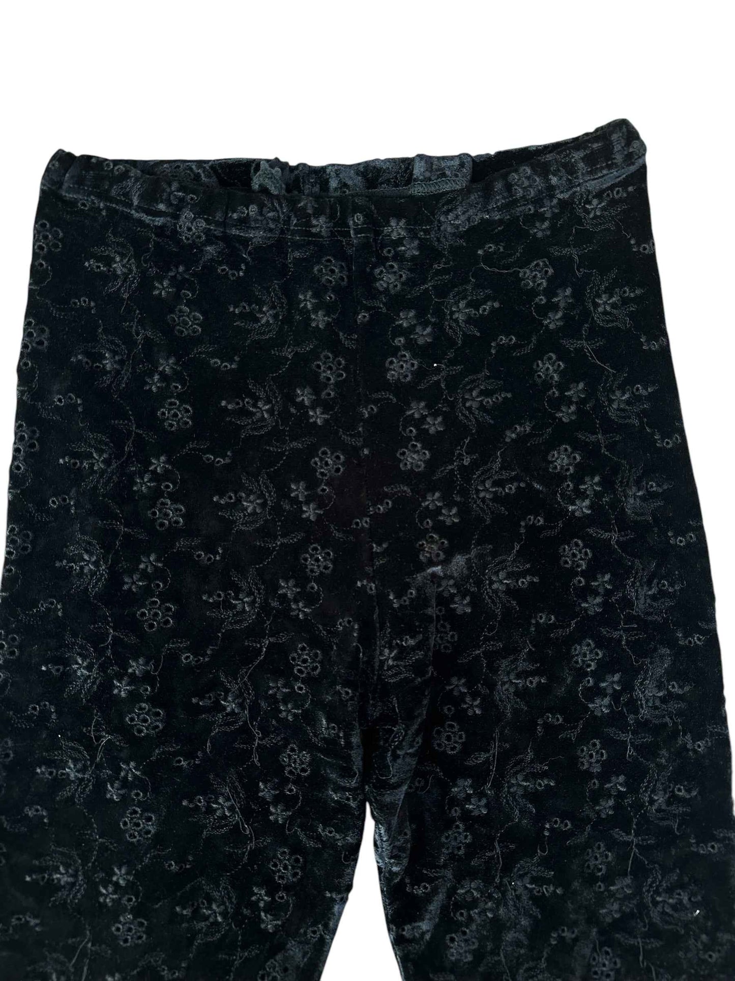 Pantaloni con fiorellini traforati
