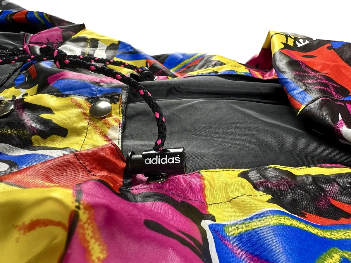Giacca a vento vintage Adidas anni '90 nera con striscia a fantasia
