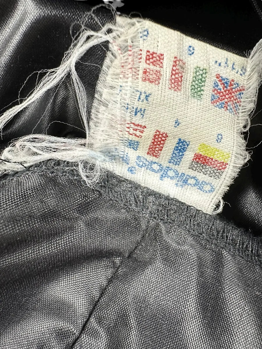 Giacca a vento vintage Adidas anni '90 nera con striscia a fantasia